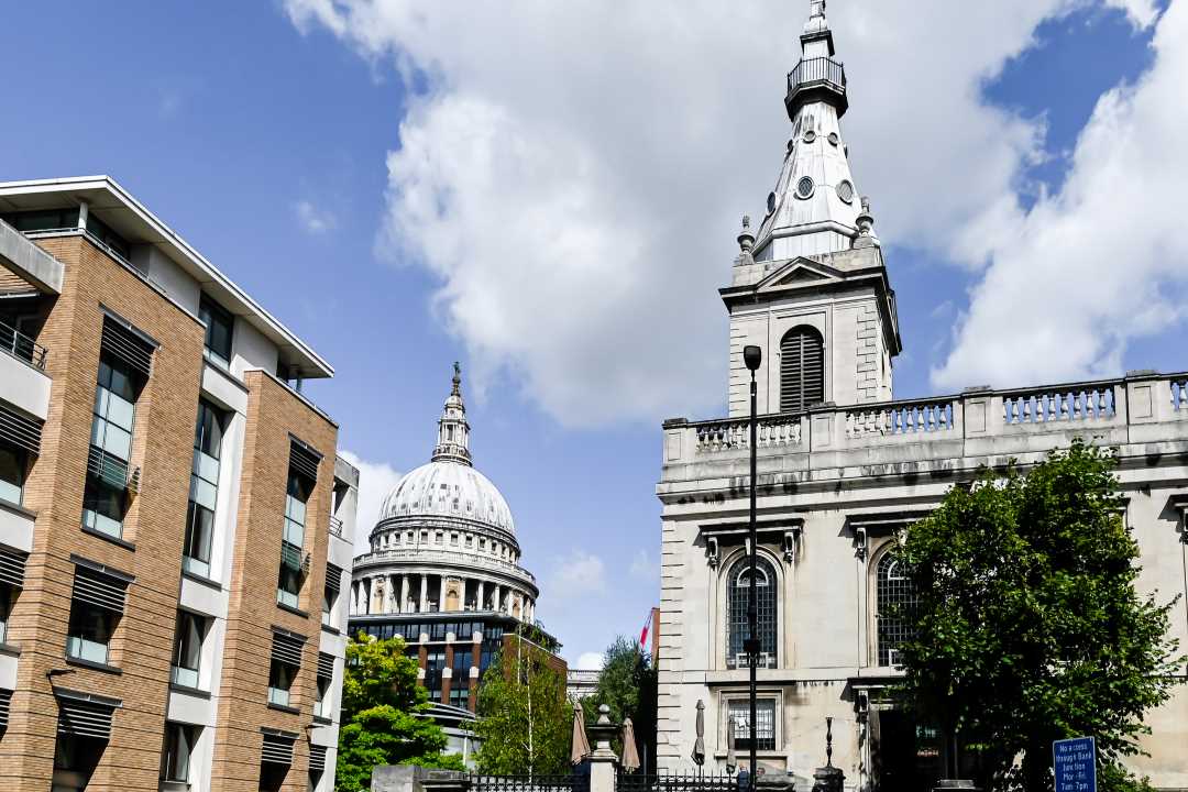 st Nicholas Cole Abbey in front of St Pauls Cathedral in London